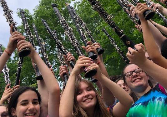 group holding clarinets